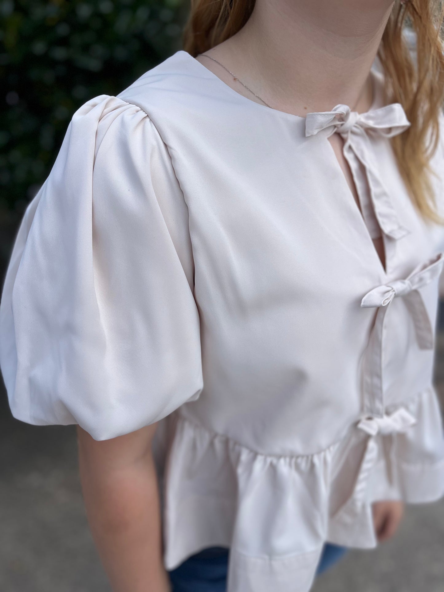 Cream Peplum Top with Bows