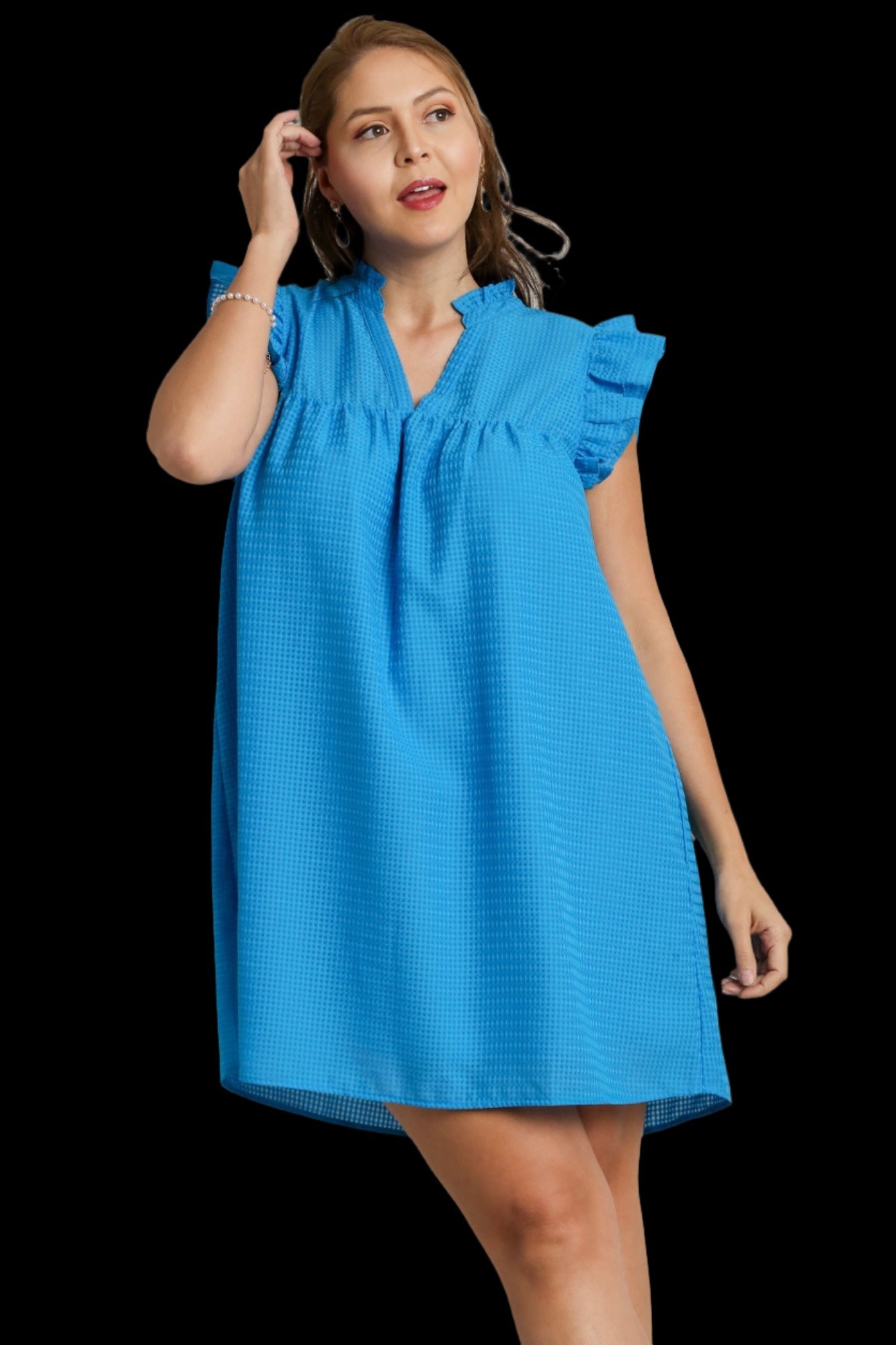 This elegant plus size dress features a woman in a stunning blue dress with ruffled shoulders, perfect for any special occasion. The dress is designed to flatter and accentuate curves, providing both style and comfort for the wearer. Ideal for those looking for a chic and sophisticated look, this dress is a must-have for any wardrobe.